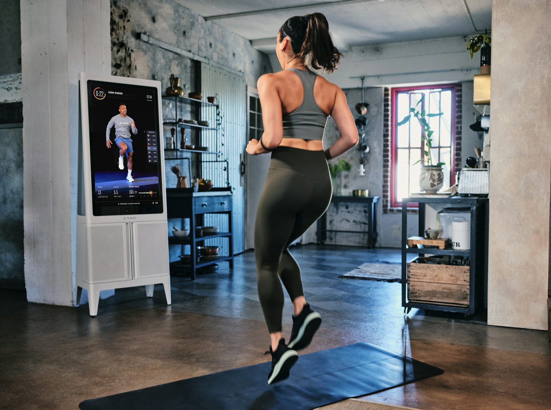 Woman high knee workout with Tempo Studio 